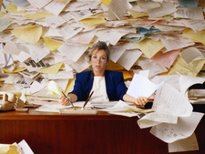 Office Worker with Mountain of Paperwork