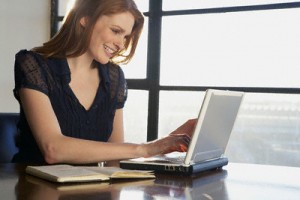 Woman Typing on Laptop